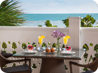 A table set for breakfast overlooking the beach.