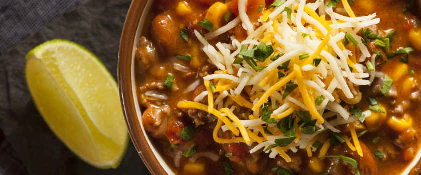 Southwestern Santa Fe soup with cheese on top.