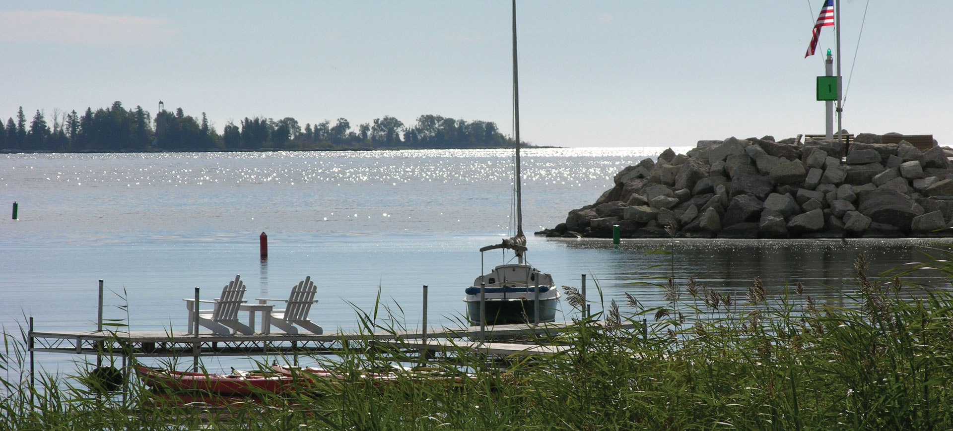 Two chairs sit on the dock at Blacksmith Inn on the Shore, which overlooks Lake Michigan.