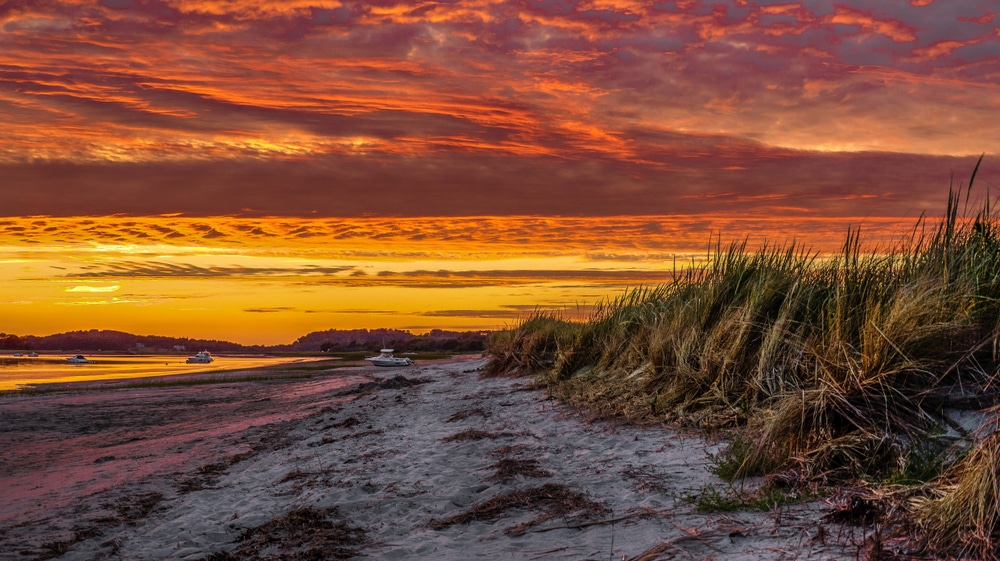 Enjoy a sunset view over the river after visiting the Crane Estate in Ipswich, MA