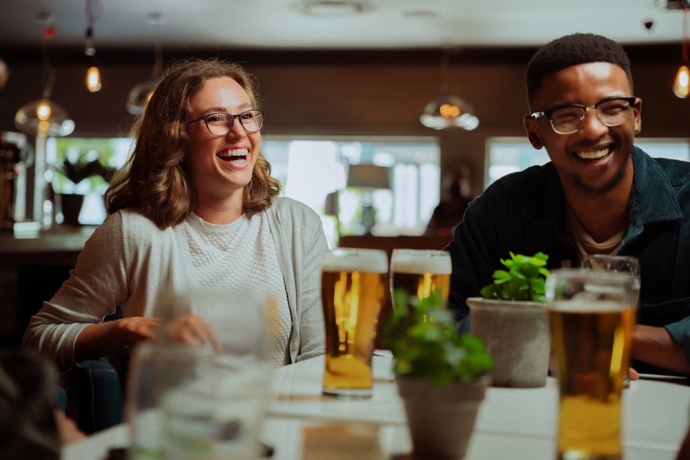 Diverse couple enjoying a fun date night at the top Pittsburgh Restaurants